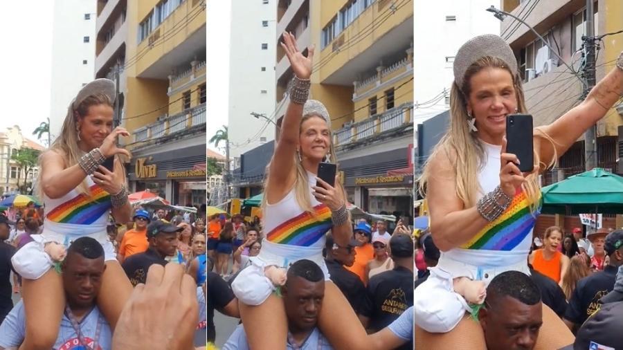 Carla Perez subiu em cima dos ombros de segurança negro no Carnaval